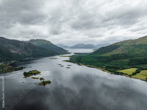 Aerial view of serene Loch Leven surrounded by majestic mountains and lush greenery, Ballachulish, United Kingdom. photo