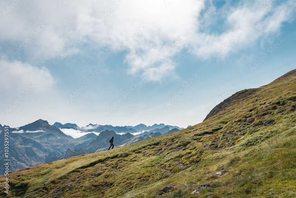 Small person walking up big mountain. High quality photo Small person walking up big mountain. High quality photo
