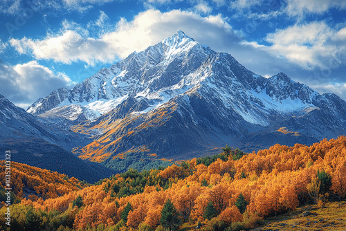 Majestic snow-capped mountain surrounded by autumn foliage