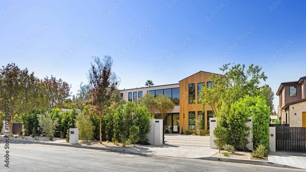 Modern luxury home with greenery and blue sky. Modern luxury home with greenery and blue sky.