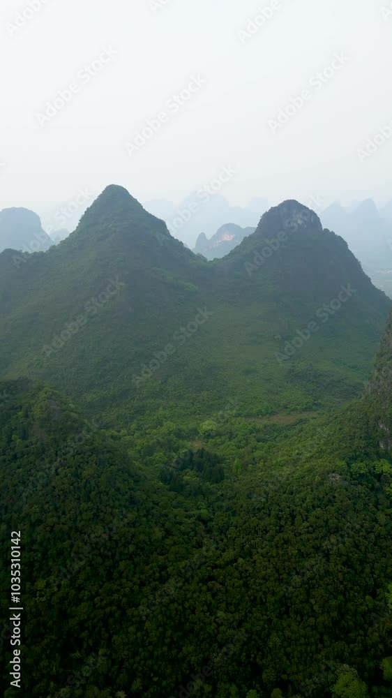Aerial view of lush green mountains and serene forests, Guilin, China. Aerial view of lush green mountains and serene forests, Guilin, China.