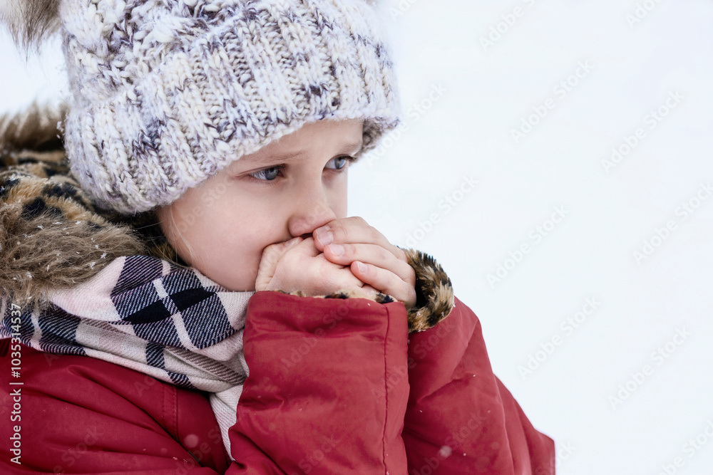 Cold Winter for Children. Little Child Freezing Shivering Outdoor on White Background. Cold Temperature Weather Safety for Children. Preventing Frostbite and Hypothermia concept. Cold Winter for Children. Little Child Freezing Shivering Outdoor on White Background. Cold Temperature Weather Safety for Children. Preventing Frostbite and Hypothermia concept.