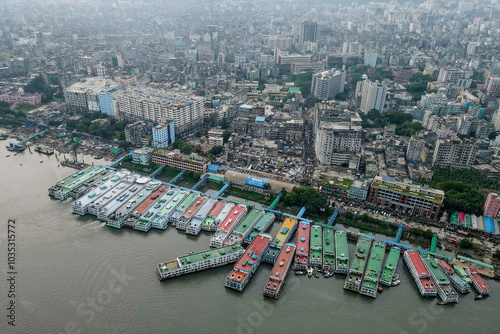 Aerial view of Sadarghat with ships on the Buriganga River and a bustling cityscape, Keraniganj, Bangladesh. photo