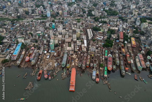 Aerial view of bustling Sadarghat port with ships on the Buriganga River and modern cityscape, Keraniganj, Bangladesh. photo