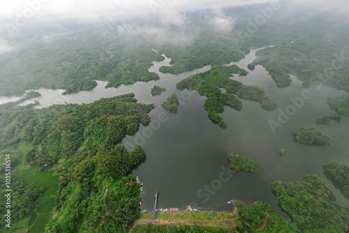 Aerial view of serene Mohamaya lake surrounded by lush greenery and tranquil islands, Chattogram, Bangladesh. photo