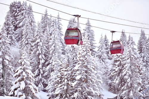 Ski lifts over the slopes of Courchevel ski resort by winter