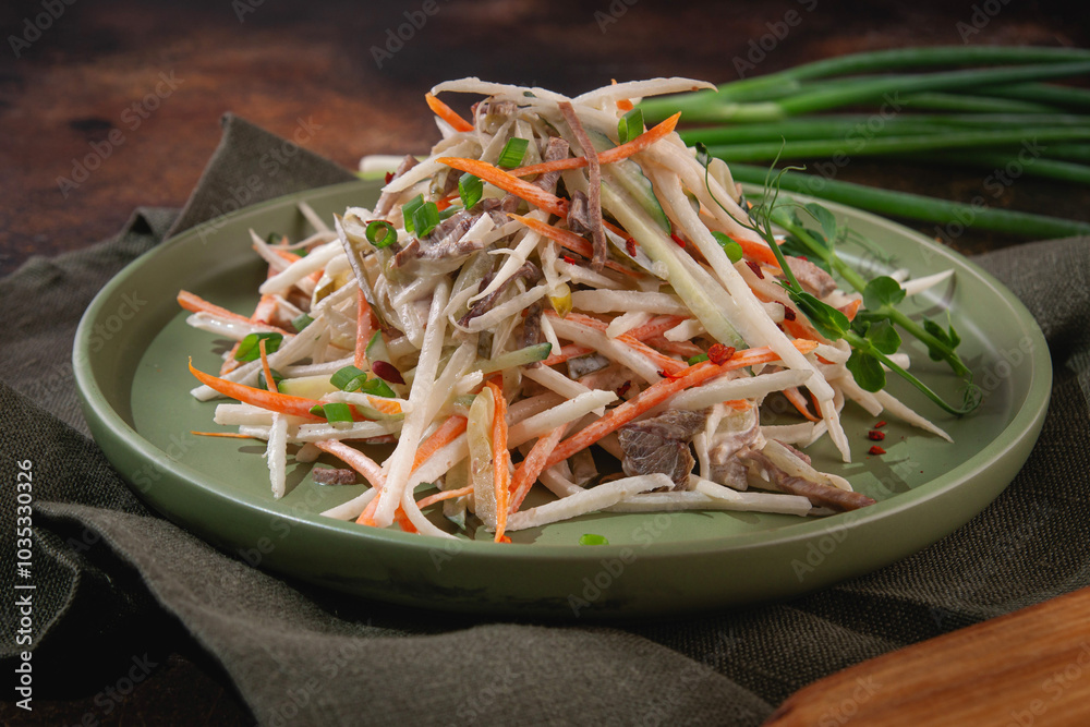 Russian cuisine. Salad with cabbage, beef, carrots and cucumbers Russian cuisine. Salad with cabbage, beef, carrots and cucumbers