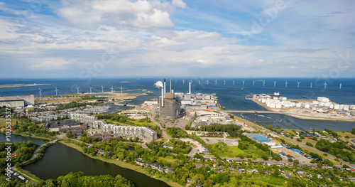 Aerial view of copenhill power plant with wind turbines and harbor, copenhagen, denmark. photo