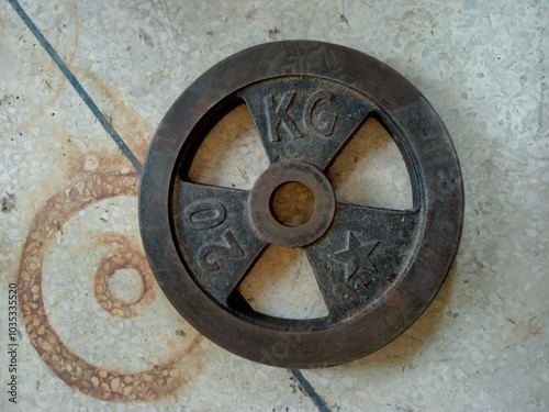 A 20 kg weight plate on ground, GYM equipment