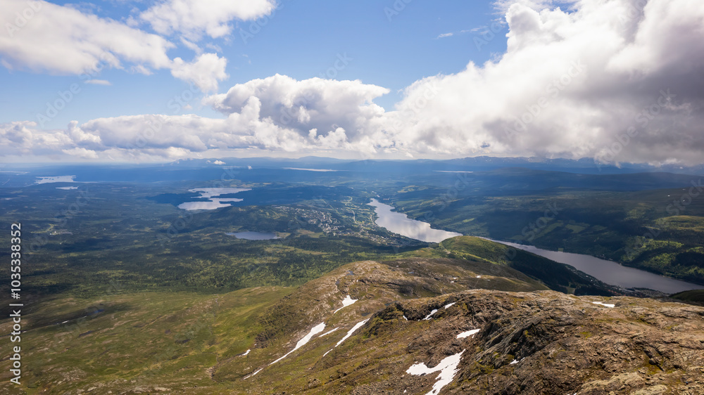 Aerial view of serene Are Lake surrounded by majestic mountains and clouds, Are, Jamtland, Sweden. Aerial view of serene Are Lake surrounded by majestic mountains and clouds, Are, Jamtland, Sweden.