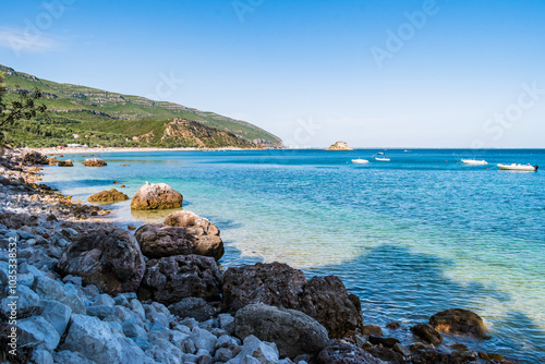 Rocks and clear turquoise sea at Portinho da Arrábida beach, Setúbal PORTUGAL photo