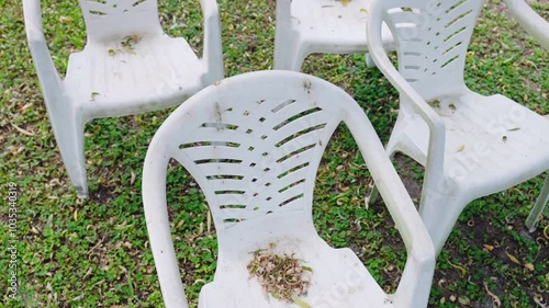 Serious problem of environment pollution with abandoned plastic because of human bad behavior and irresponsibility, plastic chairs on the street, cluttered area with long recycling garbage, concept of