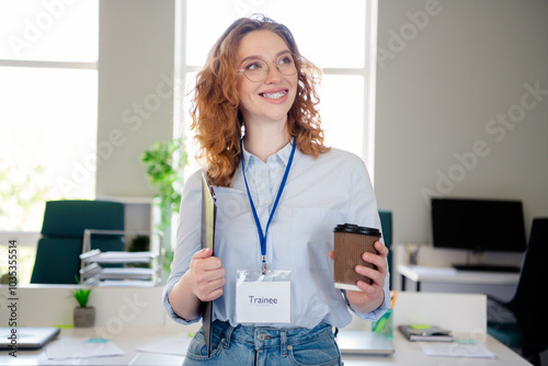 Photo of pretty young girl drink coffee trainee look empty space wear formalwear business adviser coworking successful nice light office photo