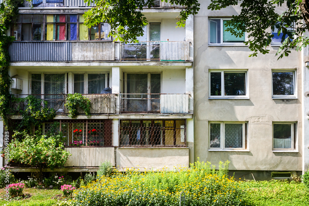 Soviet era architecture style of living district in Vilnius, Lithuania. Post-soviet urban architecture. Wall with windows and balconies. Soviet era architecture style of living district in Vilnius, Lithuania. Post-soviet urban architecture. Wall with windows and balconies.