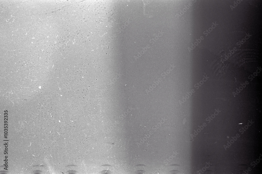 Obraz premium Blank grained film strip texture background with heavy grain, dust and light leak