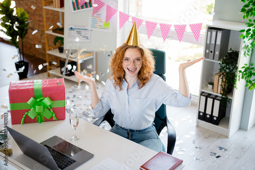 Photo of pretty young girl celebrate birthday giftbox confetti wear formalwear business adviser coworking successful nice light office