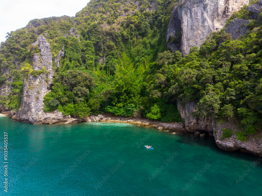 A secluded cove surrounded by lush cliffs and turquoise waters. A secluded cove surrounded by lush cliffs and turquoise waters.