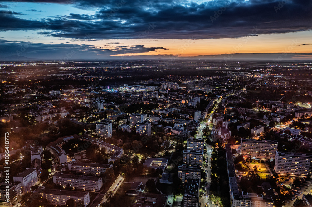 Fototapeta premium Cityscape Aerial View at Dusk With Illuminated Streets, Wroclaw Poland