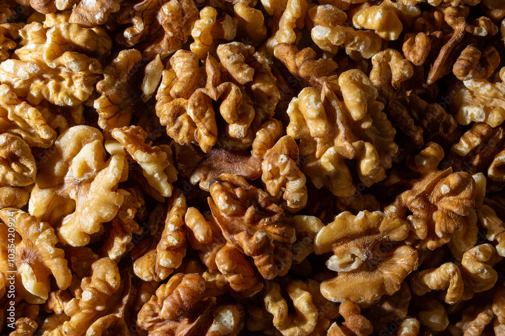 Scattered Shelled Walnuts. Background from Walnut. Natural High-Calorie Snacks Scattered Shelled Walnuts. Background from Walnut. Natural High-Calorie Snacks
