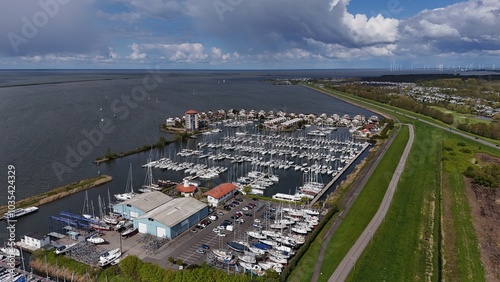 Aerial View of Marina with Sailboats and Coastal Landscape