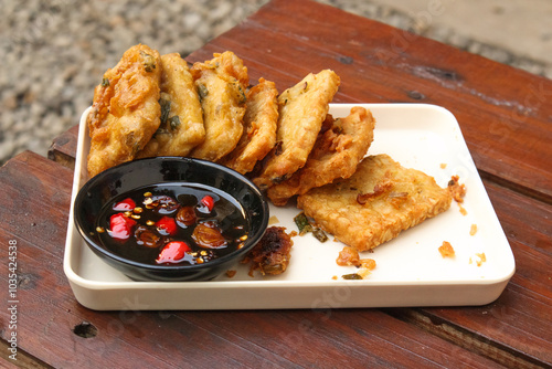 Tempe Mendoan is a Type Fried Food From Indonesian photo