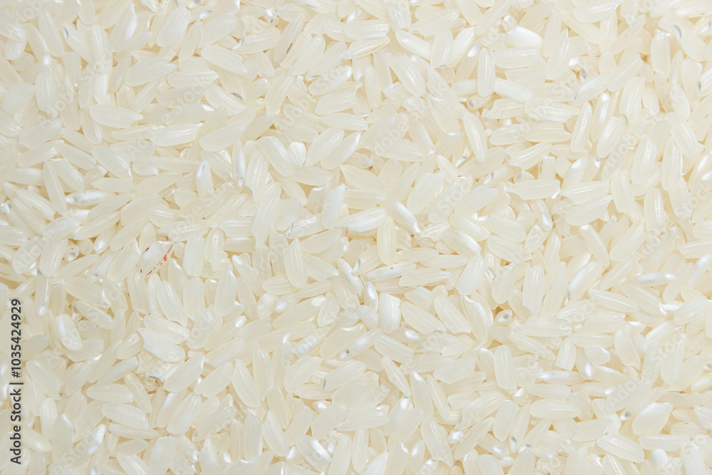 Dry Uncooked White Rice Background - Top View, Flat Lay. Scattered Raw Long Grain Rice. Asian Cuisine and Culture. Healthy Eating Ingredients. Diet Food Dry Uncooked White Rice Background - Top View, Flat Lay. Scattered Raw Long Grain Rice. Asian Cuisine and Culture. Healthy Eating Ingredients. Diet Food