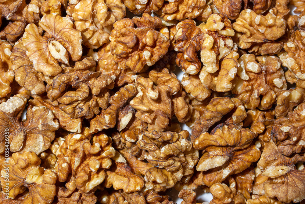Scattered Shelled Walnuts. Background from Walnut. Natural High-Calorie Snacks Scattered Shelled Walnuts. Background from Walnut. Natural High-Calorie Snacks