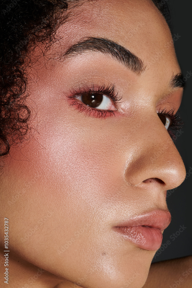 A stylish woman highlights her exquisite makeup artistry with confidence and allure. A stylish woman highlights her exquisite makeup artistry with confidence and allure.