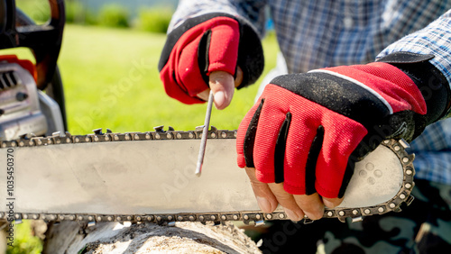 a master sharpens a chain at a chainsaw