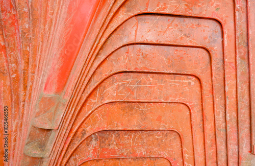 Close Up View Of The Side View Of The Orange Plastic Chairs, Arranged Neatly And Tightly, Photo Taken In Portrait Mode photo