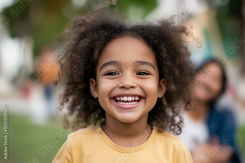 Portrait of joyful child smiling outdoors