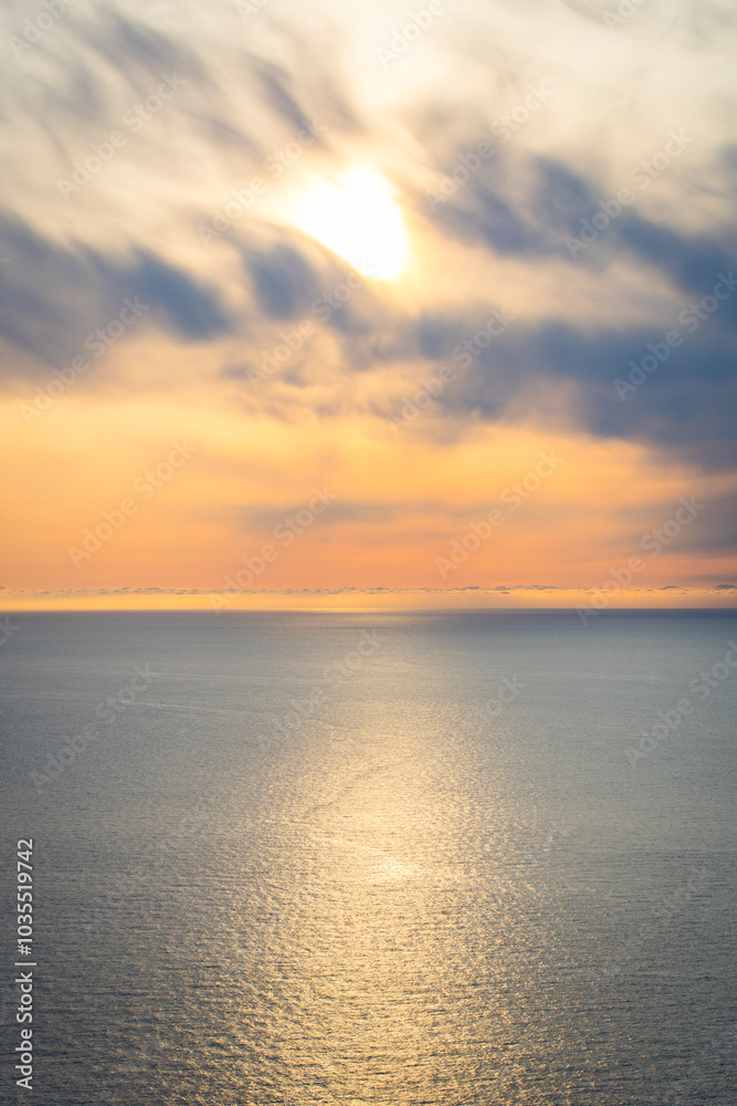 View of serene sunset over the Barent Sea with the midnight sun, Honningsvag, Norway. View of serene sunset over the Barent Sea with the midnight sun, Honningsvag, Norway.