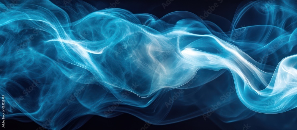 Fototapeta premium Abstract blue smoke swirls on a dark background.