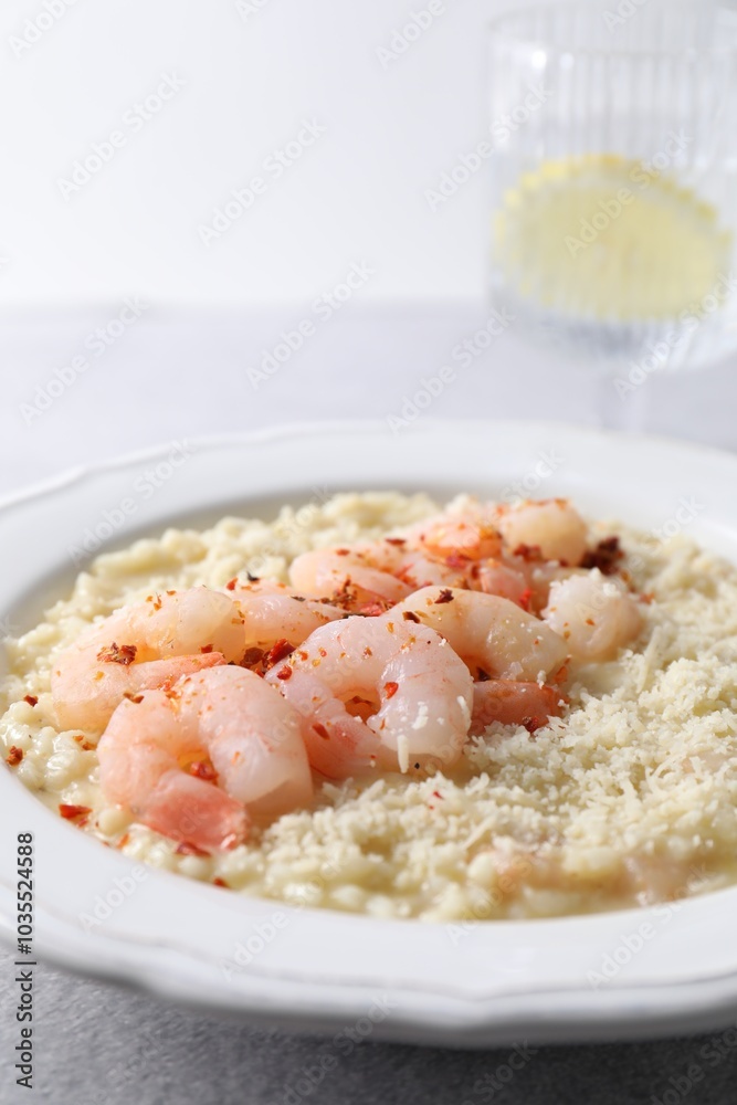 Delicious risotto with shrimps and cheese on table, closeup Delicious risotto with shrimps and cheese on table, closeup