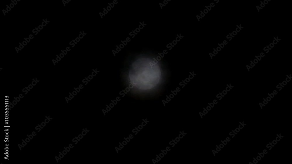 Timelapse of the moon covered in dramatic dark clouds. The view of the sky when the moon is covered by dark clouds gives an impression of horror Timelapse of the moon covered in dramatic dark clouds. The view of the sky when the moon is covered by dark clouds gives an impression of horror