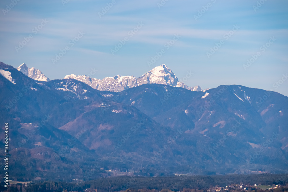 Φωτογραφία Panoramic view of snow-capped mountain peak Mangart in Julian Alps seen from Sternberg in Wernberg, Carinthia, Austria