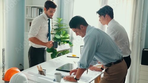 Top view of professional architect engineer team writing sticky notes and sticking note at meeting table while interior designer talking and discussing about building exterior designing. Alimentation.