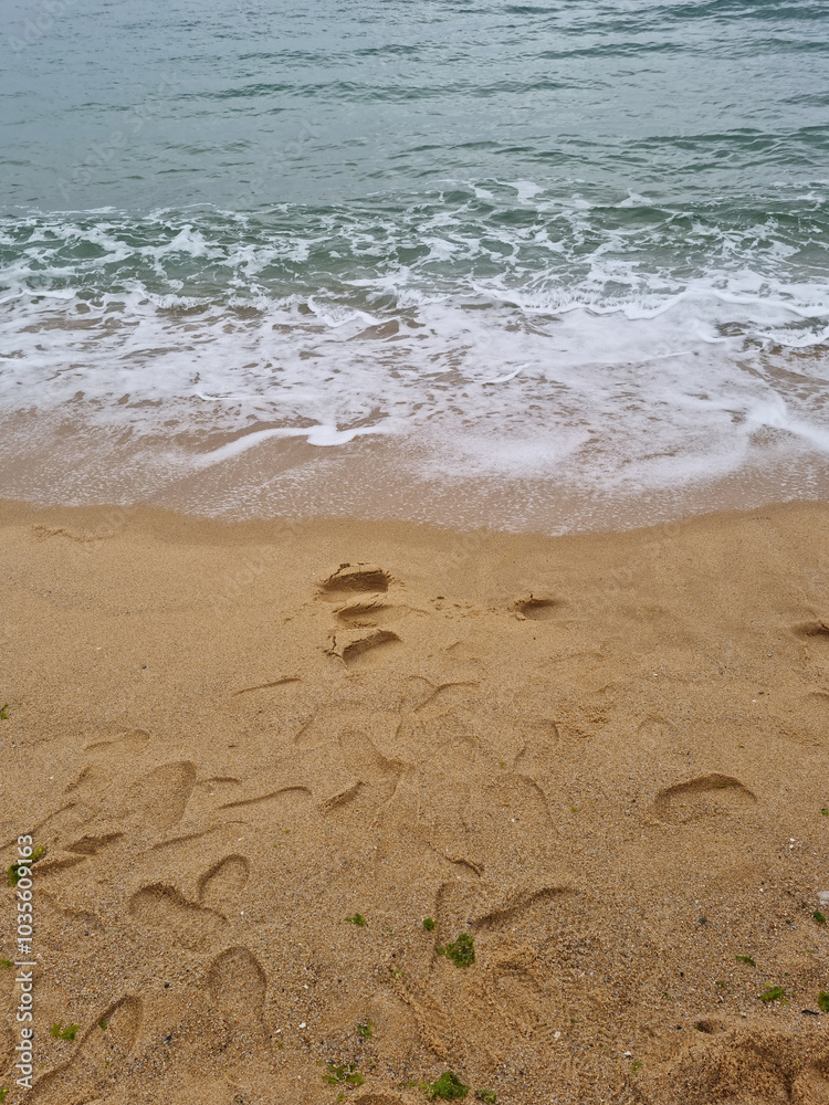 It is a beach where waves come in. It is a beach where waves come in.