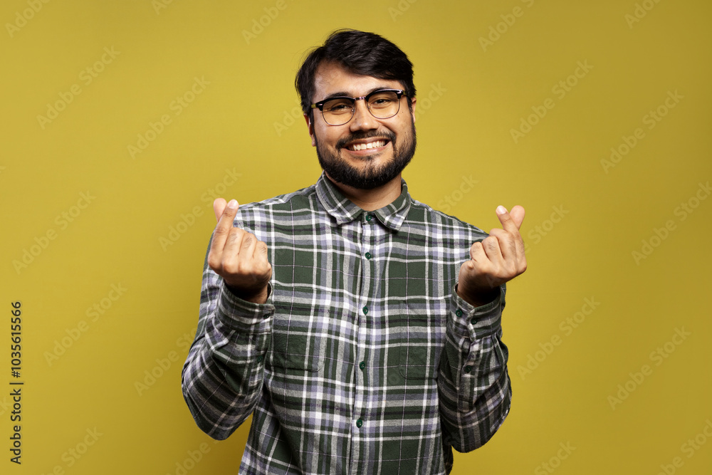 man smiling making heart with his fingertips man smiling making heart with his fingertips