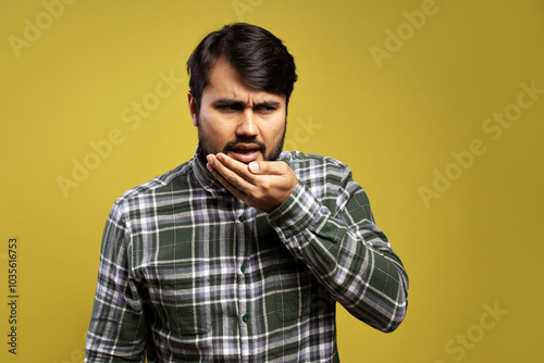 man checking to see if his breath is fresh