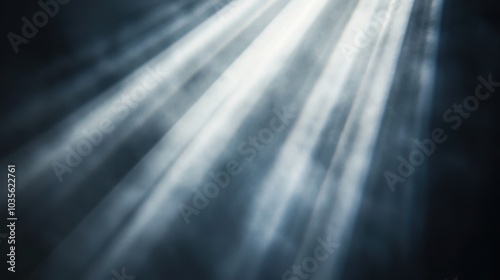 Abstract light beams shining through smoky dark background, stage lighting, spotlight