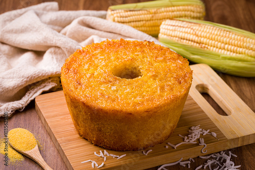 Obraz na plátně Delicious Corn Cake With Coconut on Wooden Cutting Board