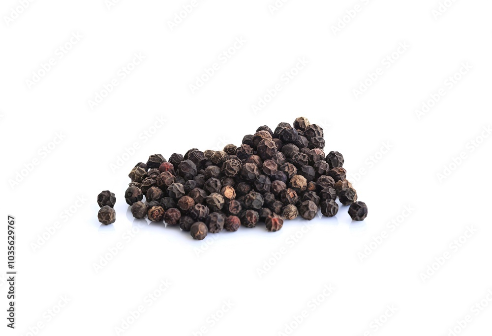 Pile of black peppercorns on a white background Pile of black peppercorns on a white background