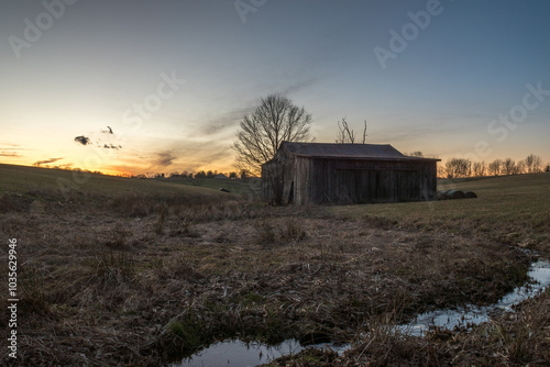 sunset over barn union kentucky