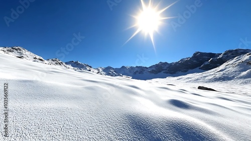 Snowy Mountain Landscape with Bright Sun and Blue Sky