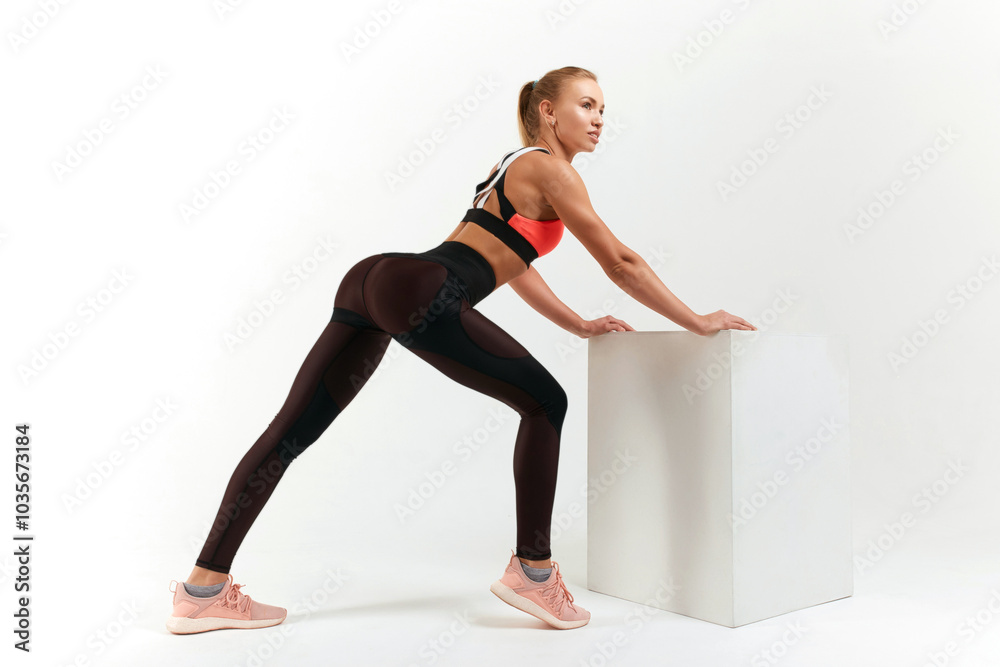 Fit in exercises in bright studio healthy young woman blonde doing sports Fit in exercises in bright studio healthy young woman blonde doing sports