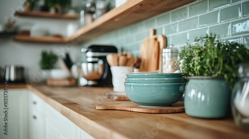 Wallpaper Mural A soothing kitchen scene with teal bowls stacked neatly, wooden countertop, and fresh herbs evokes a peaceful and harmonious cooking environment. Torontodigital.ca