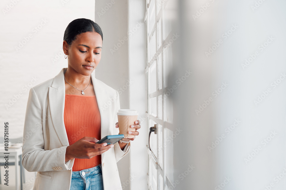 © KayExam/peopleimages.com - Business, woman and coffee with phone in office for work break, text message and checking notifications. Professional, employee and smartphone by window with social media scroll or online browsing