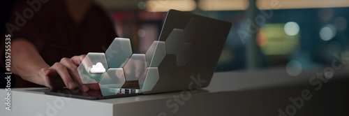 Obraz na płótnie A person is interacting with a laptop, where a virtual cloud icon is part of a hexagonal digital interface. modern technologycloud computing, emphasizing digital transformation and innovation. w salonie