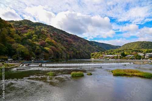 The view of Katsura River at autumn from Togetsukyo Bridge, Kyoto, Japan. A well-known place of scenic beauty in the western hills of Kyoto. Nature and travel concept. photo